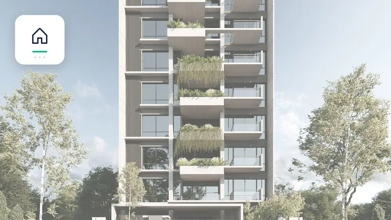 Inmueble residencial y comercial moderno con símbolo de inmueble y pago – imagen editorial para «Cobro de deudas en créditos de alquiler: documentación, plazos y fases de escalación».